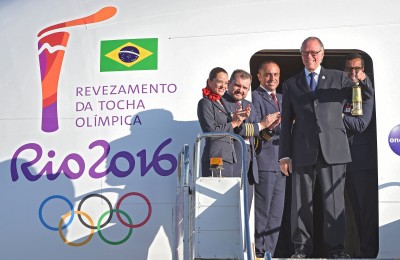 Brazilian Olympic Committee President Carlos Arthur Nusmann holds the Olympic flame as he arrives in Brasilia from Geneva on May 3, 2016, beginning the flame's journey across the country before the start of the 2016 Olympic Games on August 5. 
The Olympic flame arrived in Brasilia May 3 aboard a flight from Geneva to embark on a  procession across Brazil culminating in the opening ceremony of the 2016 Games in Rio de Janeiro. The torch will travel to more than 300 towns and cities carried by some 12,000 relay runners before arriving August 5 at the mythic Maracana stadium to kick off the first Olympics in South America. / AFP / EVARISTO SA        (Photo credit should read EVARISTO SA/AFP/Getty Images)