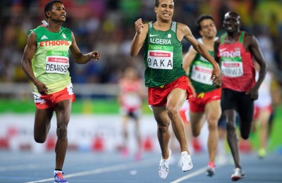 In this photo released by IOC, Algeria's Abdellatif Baka narrowly wins the gold ahead of Ethiopia's Tamiru Demisse in the men's 1,500-meter T13 final athletics event at Olympic Stadium during the Paralympic Games in Rio de Janeiro, Brazil, Sunday, Sept. 11, 2016. (Bob Martin/OIS,IOC via AP)